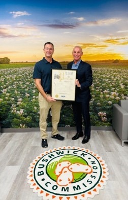 Bushwick Commission team poses with a certificate recognizing the company’s designation as a historic business by the New York State Historic Business Preservation Registry, celebrating 90 years of service and resilience.