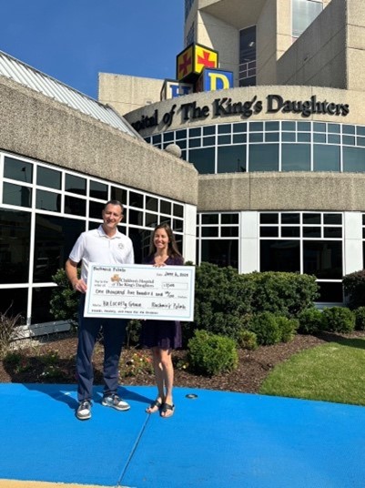 Representatives from Bushwick Commission hold a large ceremonial check in front of the Children’s Hospital of The King’s Daughters in Norfolk, VA, showcasing their support for the local community through a recent promotion.